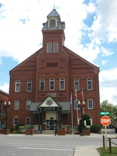 Featured is the red brick façade, including the central projection and tower.; Kayla Jonas, 2008.