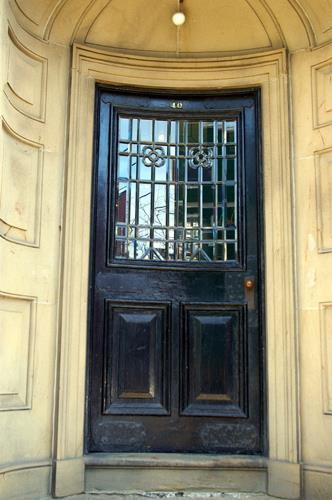 This image shows the entrance with vaulted portico and curved door; City of Saint John, 2007