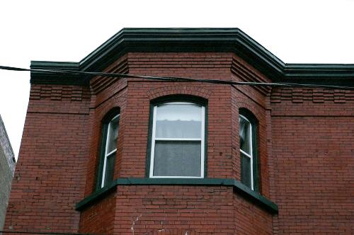 This photograph illustrates the corbel bands at the cornice, 2007; City of Saint John