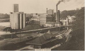 Of note is the station in the foreground, with the busy harbour beyond.; Reuben R Sallows Gallery, Goderich, n.d.