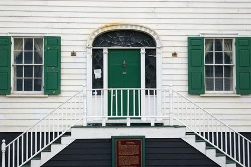 This image shows the transom, sidelights, wooden door and flanking windows; City of Saint John
