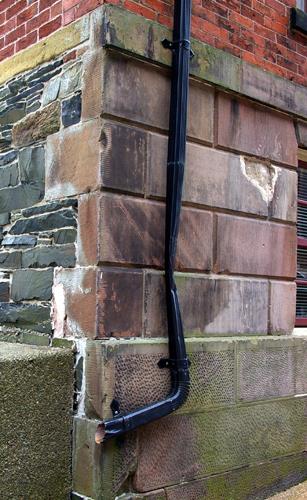 This photograph shows the plinth band that surmounts the Ashlar masonry with dressed stone, 2007; City of Saint John
