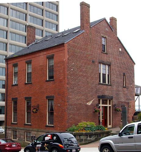 This photograph shows the contextual view of the building and the typical Neo-Classical placement of four chimneys, 2007; City of Saint John