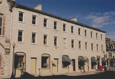 Of note is the pattern of alternating doors and windows on the ground level storefront.; Gord Strathdee, 2007.