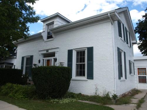Of note is the small dormer window above the entrance.; Kayla Jonas, 2008.