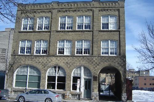 Of note are the four Romanesque arches on the first storey.; Paul Dubniak, 2008.