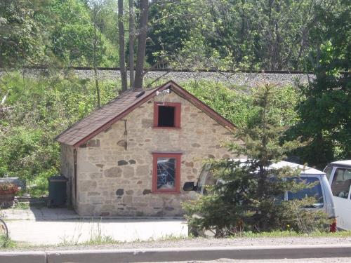 Featured is the fieldstone bake-oven and smokehouse.; Chelsey Tyers, 2008.