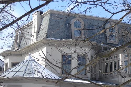 Featured is the mansard roof with round-headed dormers and metal cornice.; Kayla Jonas, 2008.