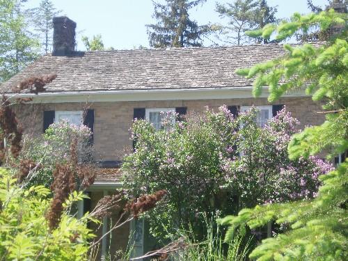 Featured is the gable roof and one of the brick chimneys.; Chelsey Tyers, 2008.