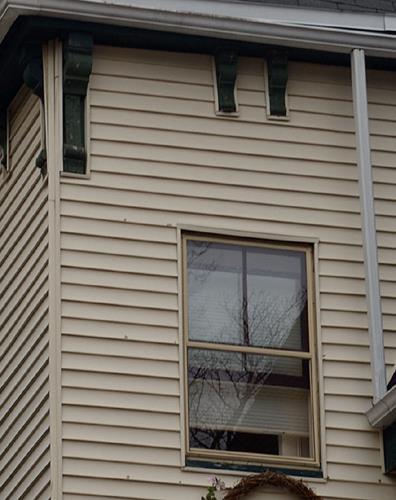 This side view of the residence shows vertical sliding wood window and brackets; City of Saint John, 2008