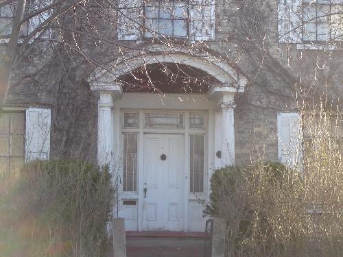 Featured is the main entrance, covered by a semi-circular hood.; Emily Elliott, 2008.
