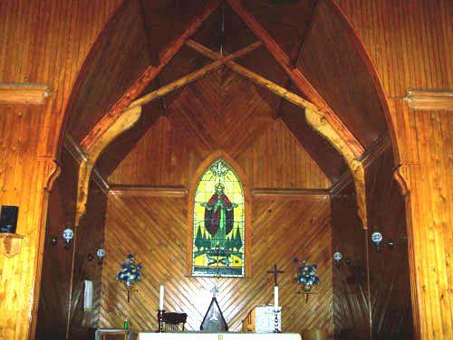 Altar showing supports in building and stained glass window, Holy Trinity Church, Country Harbour Mines, NS; Heritage Division, NS Department of Tourism, Culture and Heritage, 2009