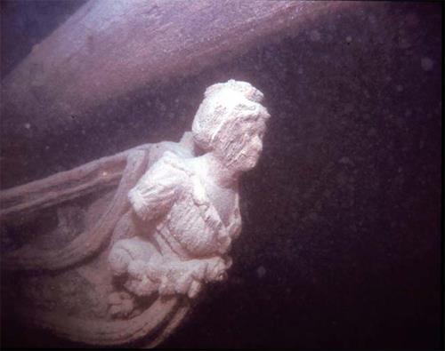 Underwater image of the Hamilton and Scourge showing the figurehead, 1982.; National Geographic, 82-1990, 1982.