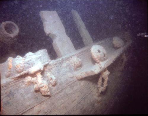 Underwater image of the Hamilton and Scourge showing the side of the hull, 1982.; National Geographic, 82-1874, 1982.