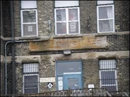 Featured is the name “Military Stores” inscribed on the facade.; Emily Elliot, 2007.