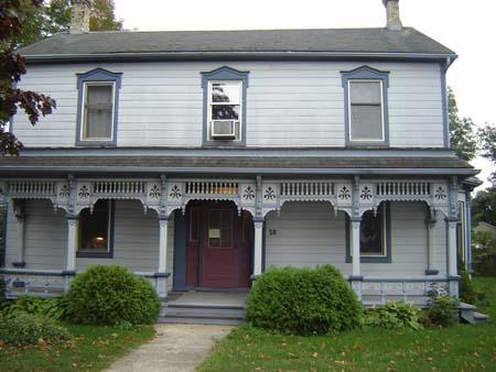 Featured is the symmetrical three bay façade with veranda.; Kayla Jonas, 2007.