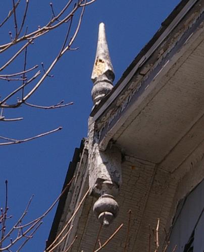 This image shows the side gable of the residence with a finial; City of Saint John, 2008