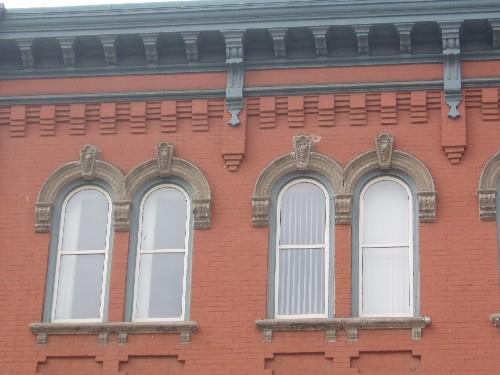 Of note are the double hung windows with frames, hoodmolds, keystones, and stone sills.; Chelsey Tyers, 2008.