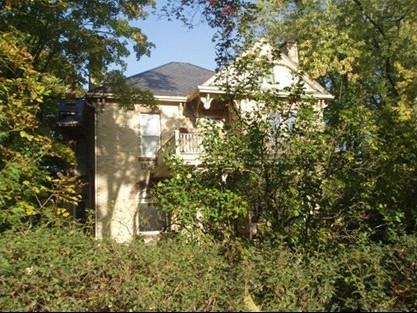Of note are the decorative brackets and slate clad roof.; Paul Dubniak, 2008.