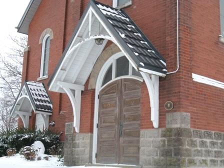 Featured is the semi-circular double door entrance.; Marth Fallis, 2008.