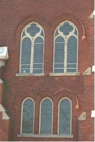 Featured are stained glass windows with brick voussoirs.; Town of Milton, ND.