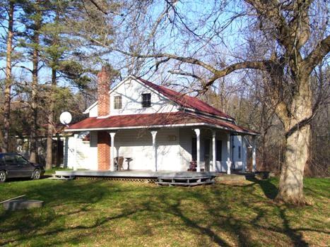 Featured is the one-and-a-half storey farmhouse.; Sally Drummond, 2008.
