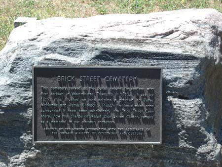 Featured is the plaque commemorating the early settlers who are interred at the cemetery.; Kendra Green, 2007.