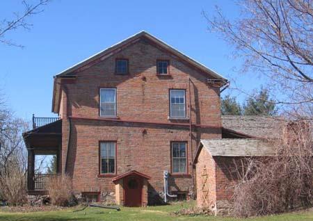View of the east elevation of the home and smoke house as seen from Arthur Road, 2007.; Lindsay Benjamin, 2007.