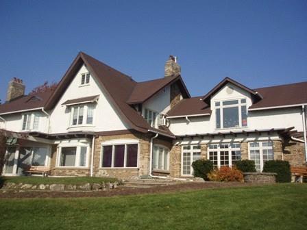 Of note is the prominent cross gable.; Martha Fallis, 2008.