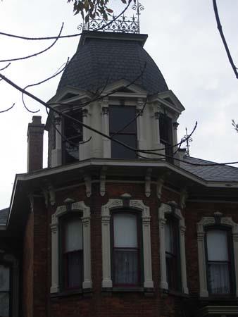 Featured is the corner tower with mansard roof and iron cresting.; Kayla Jonas, 2007.