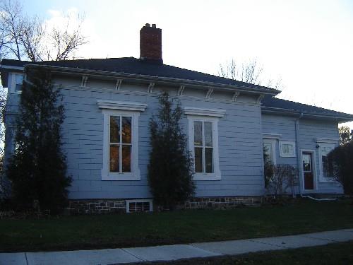 Of note are the roof brackets and frieze typical of the Greek Revival style.; Kayla Jonas, 2008.