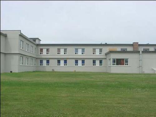 Rear view of Barrack Block (Building H23) at Canadian Forces Base Gagetown.; Department of National Defence / Ministère de la Défense nationale, 2001.