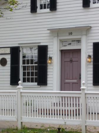Of note is the front entrance with double panel door, recessed transom and Doric order pilasters.; Kirsten Pries, 2008.