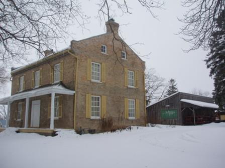 Of note is the simple veranda with four columns.; Martha Fallis, 2008.
