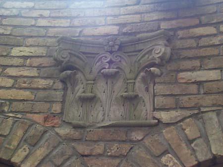 Featured is one of the salvaged stone capitals.; City of London, Planning and Development Department, 2004.