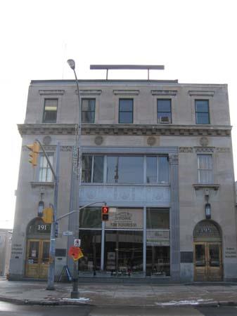 East façade featuring the large entranceways, stone detailing and medallions.; Lindsay Benjamin, 2007.