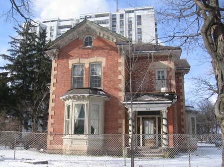 View of the curved, decorated brackets underneath the eaves.; Lindsay Benjamin, 2007.