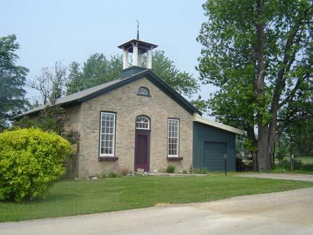 Of note are the 9 over 9 windows and the central entry with a transom topped by a fanlight.; Kayla Jonas, 2007.