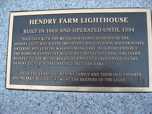 This image shows a local commemorative plaque installed on a granite cairn adjacent to the lighthouse; Village of Cambridge-Narrows