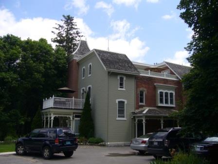 Of note is the building's lack of symmetry as seen in the windows and additions.; Kirsten Pries, 2008.