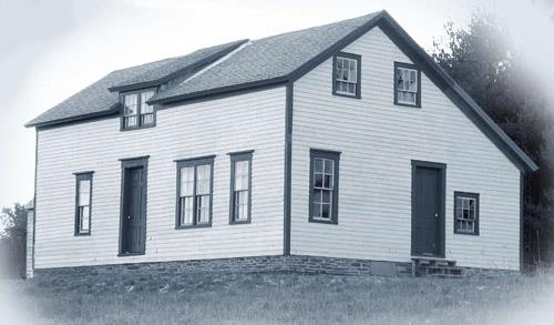 This image shows the front and north end façades of the residence; Village of Cambridge-Narrows