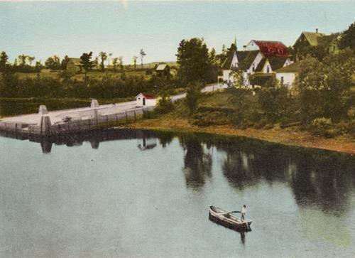 This tinted image shows Cambridge Wharf circa 1935, looking southwest; Queens County Museum Collection
