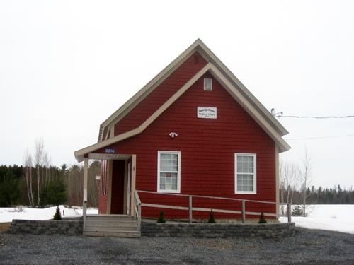 This image shows the front façade of the former Temperance Hall, now the Cambridge-Narrows Regional Library; Village of Cambridge-Narrows