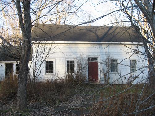 This image shows the view of the front façade of the residence; Village of Cambridge-Narrows