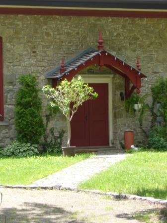 Of note is the bracketed portico with decorative finials.; Kirsten Pries, 2008.
