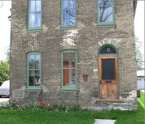 Of note is the arched transom above the entrance.; City of Brantford, 2003.