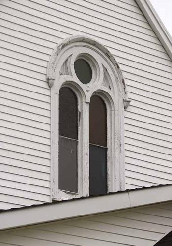 The double Roman window with oculus on the front façade; Bernard LeBlanc