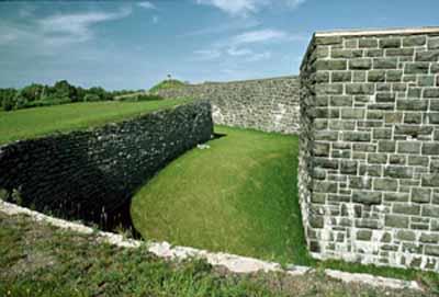 General view of the ditch, principal defensive obstacle which circled the fort, 1984.; P. St. Jacques, Parks Canada Agency / Agence Parcs Canada, 1984.