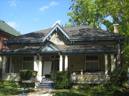 Of note is the round window in the decorative front gable.; Martha Fallis, 2008.