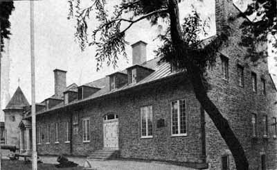 General view of Château De Ramezay / India House, showing the impressive gable parapets and the high stone chimneys, 1968.; Agence Parcs Canada / Parks Canada Agency, A. J. H. Richarson, 1968.